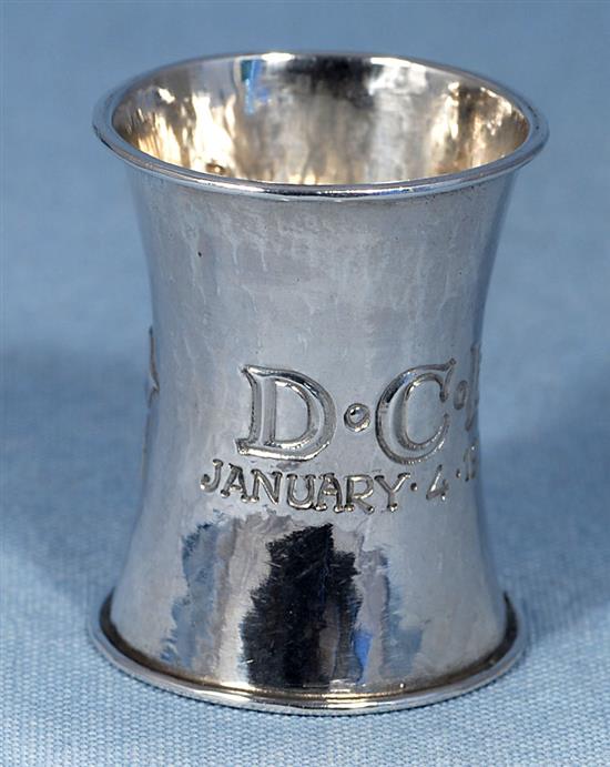 An Edwardian Arts & Crafts planished silver waisted napkin ring, by Omar Ramsden & Alwyn Carr, Height 55mm weight 1oz/33grms